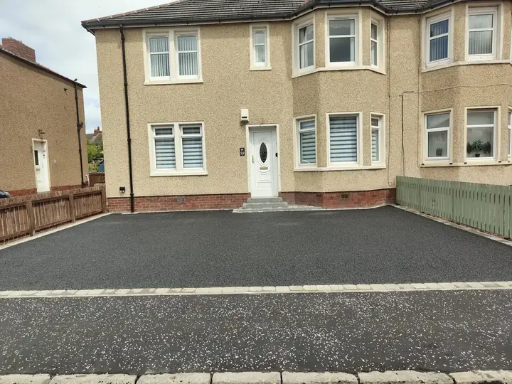 Driveway resurfacing and tarmac overlay repair at a property in Coatbridge